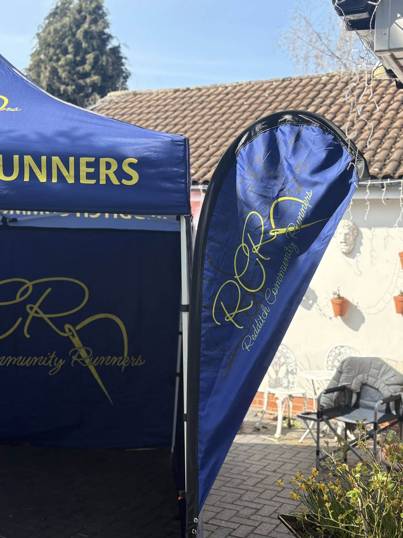 Redditch Community Runners event gazebo and flag